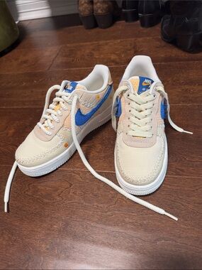 Nike women’s Cream, Blue & Yellow Air Force 1 Low Sneakers